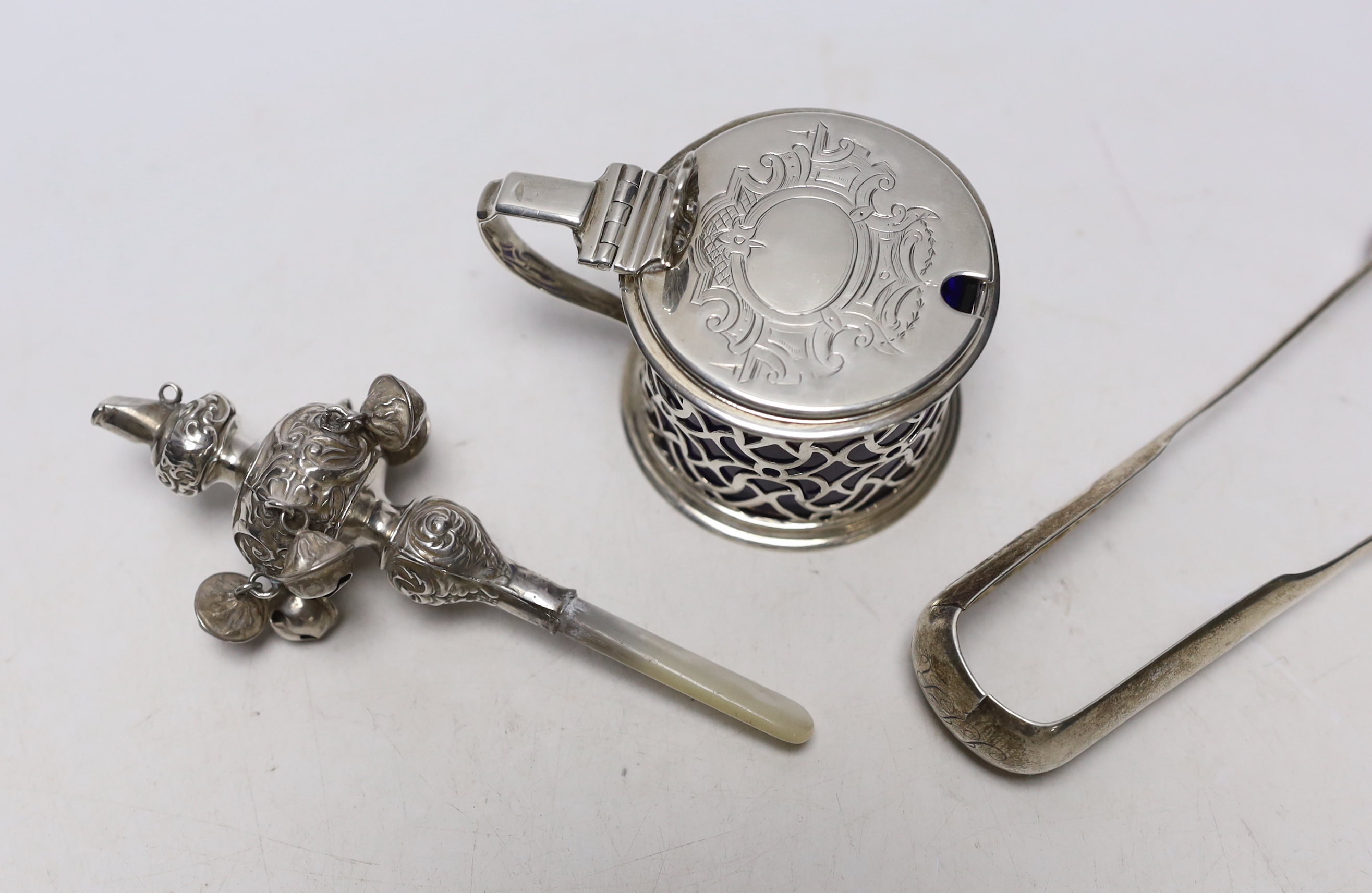 A Victorian pierced silver drum mustard pot, Charles & George Fox, London, 1854, a pair of 19th century Scottish provincial silver fiddle pattern sugar tongs, by David Gray of Dumfries, circa 1825 and a mother of pearl m